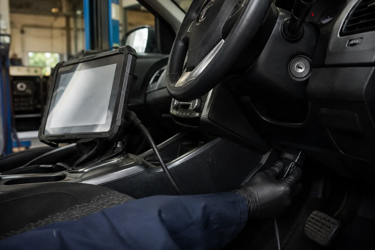 Vehicle diagnostic equipment connected inside a car