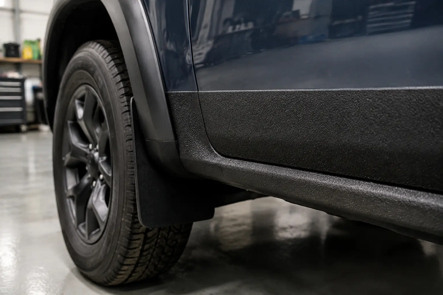 Protective textured coating detail on a utility vehicle